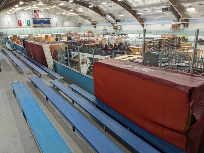 the blue bleachers in the currently unused ice arena, plus another look at the storage space