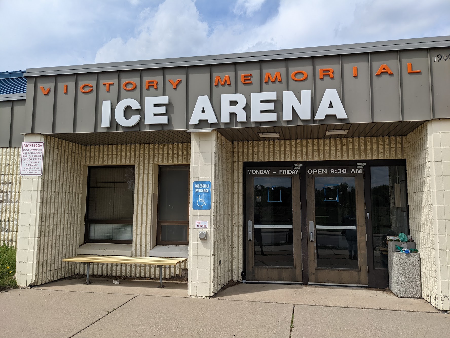 An exterior shot of victory memorial ice arena's white and orange sign