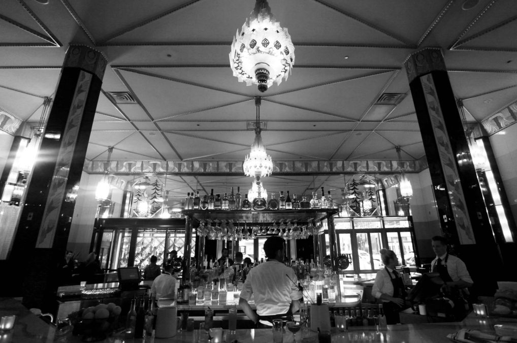 a black and white photo of the classic bar at fhima's
