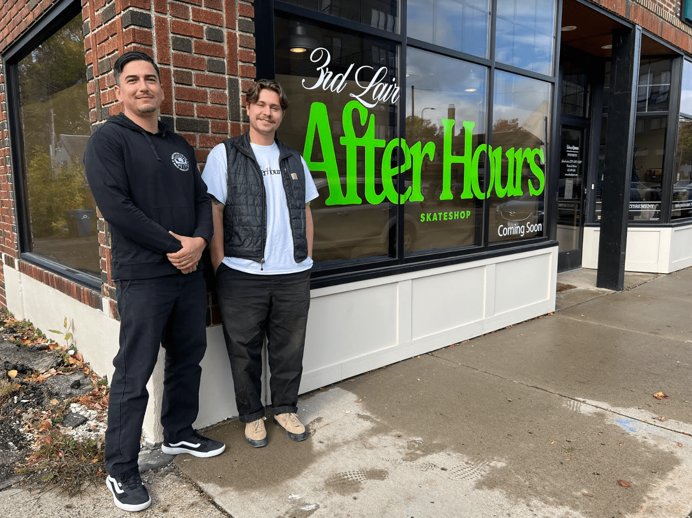 Two men, Mark Rodriguez and Oskar Barrett, stand outside their new skate shop in St. Paul.