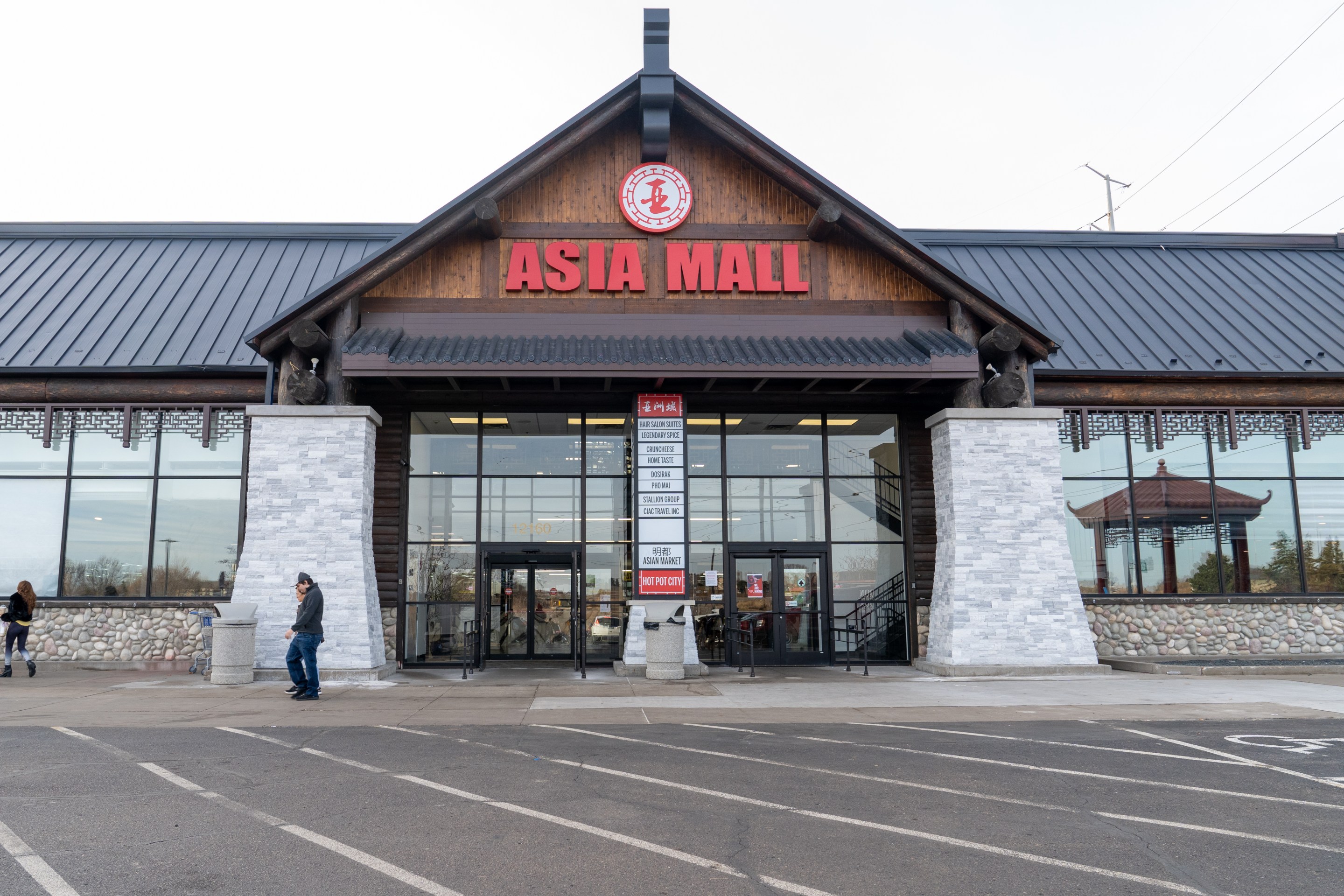 the exterior of asia mall, with a bright red sign