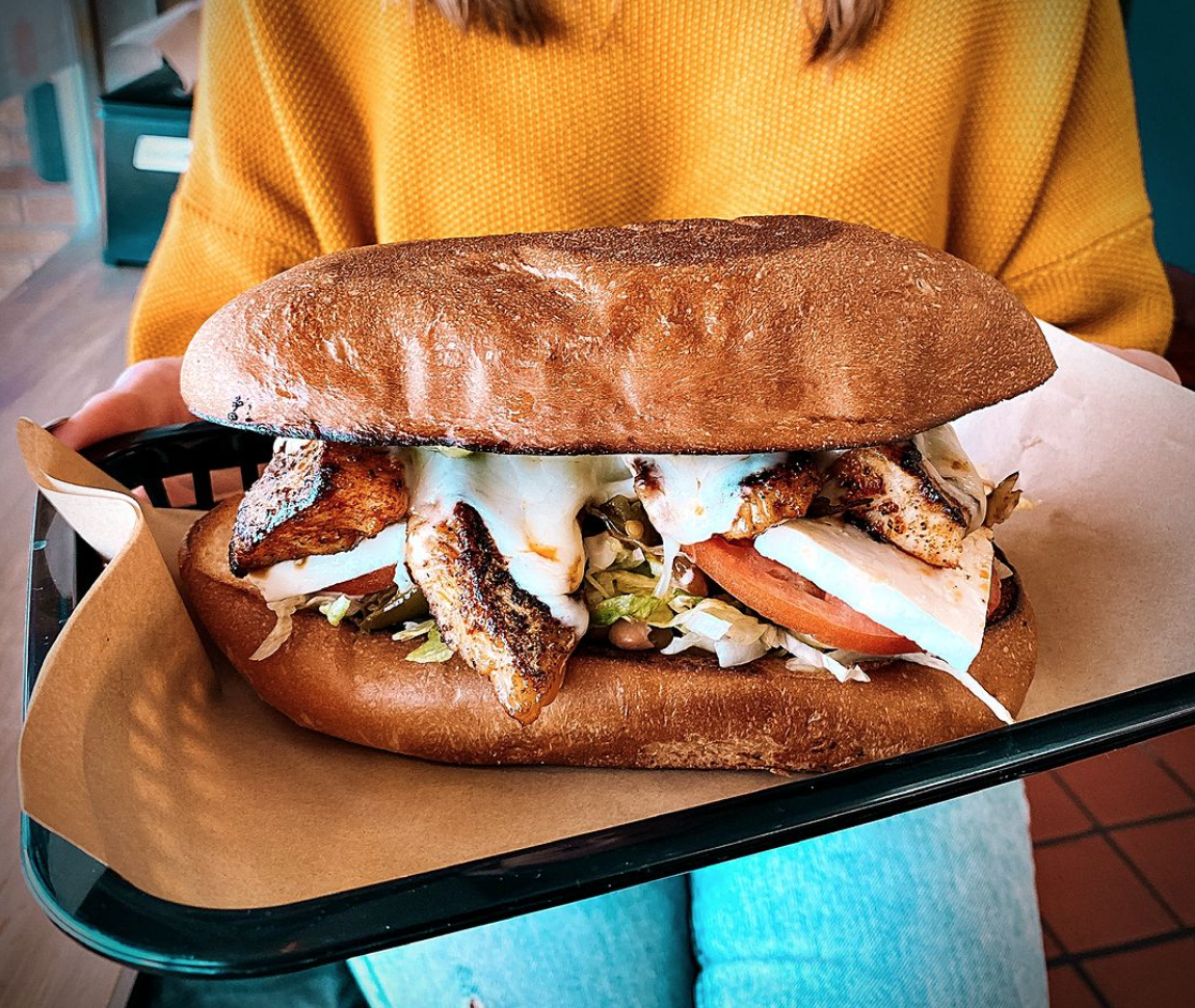a truly ginormous torta with cheese, chicken, and all kinds of veggies, dripping in sauce