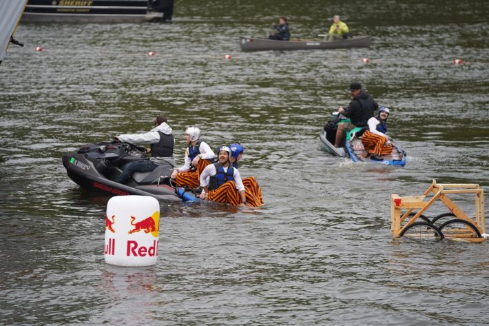 A Flugtag team from the University of Minnesota is pulled from the river.